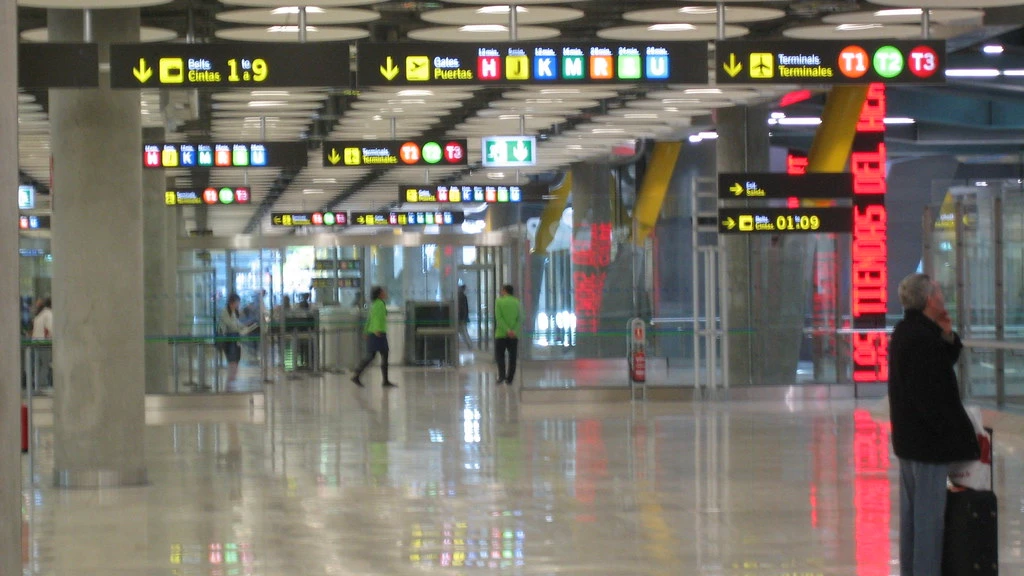 Car rental pickup steps at Madrid Barajas Airport terminal zone